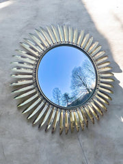 Miroir soleil métal doré