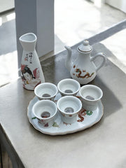 Service à saké hommes et femmes nues