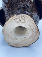 Tête de chien en terre cuite