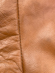 Pouf en cuir fauve années 70