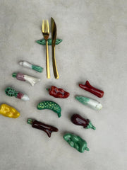 12 porte-couteaux légumes en faïence