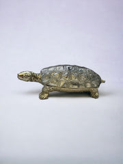 Tortue pose clé en métal argenté