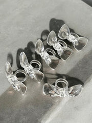 Ronds de serviette rétro noeuds en acrylique années 70