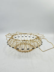 Panier à œufs « magique » pliable doré années 60