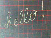 Petit tableau d’écolier quadrillé rouge