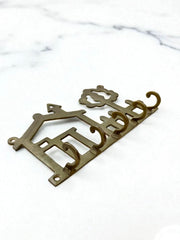 Porte clé mural en laiton