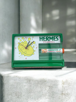 Horloge publicitaire vintage Hermes Vitamines (Omnivit)