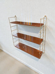 Étagère style tomado dorée années 60